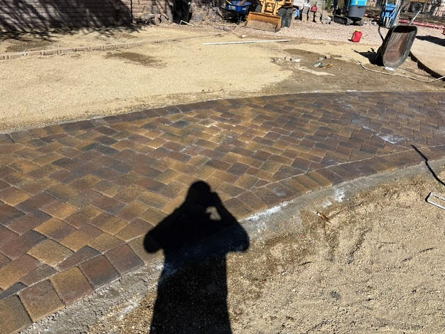Paver border being laid during a landscape install in Lake Havasu City