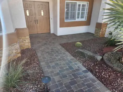 Paver entry walkway with red rock and desert plants in Lake Havasu City